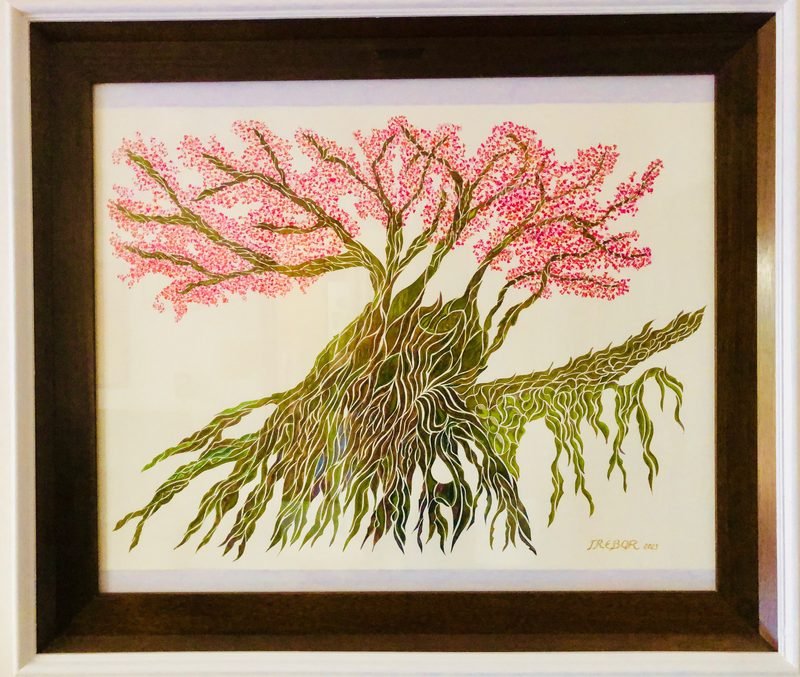 Arbre florit rosa amb tronc de mosaic, emmarcat